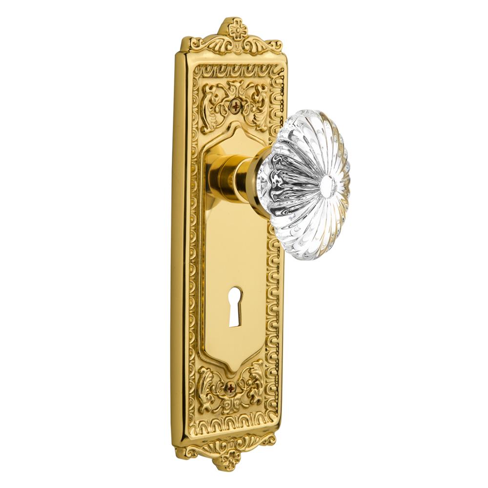 Nostalgic Warehouse EADOFC Double Dummy Knob Egg and Dart Plate with Oval Fluted Crystal Knob and Keyhole in Unlacquered Brass